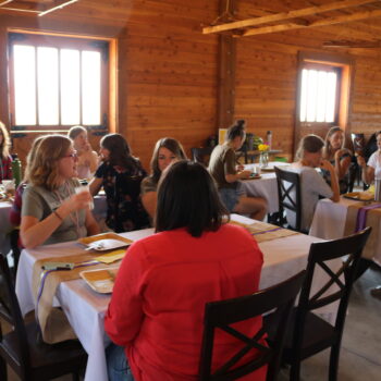 photo of women eating lunch at tables